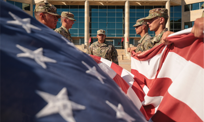 army soldiers folding American flag
